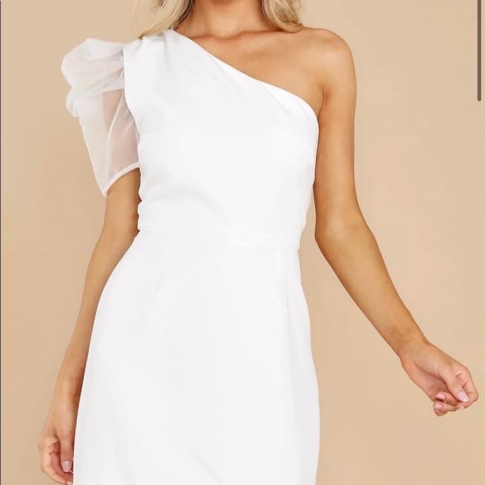 Brand new. Never worn. White one shoulder puff dress